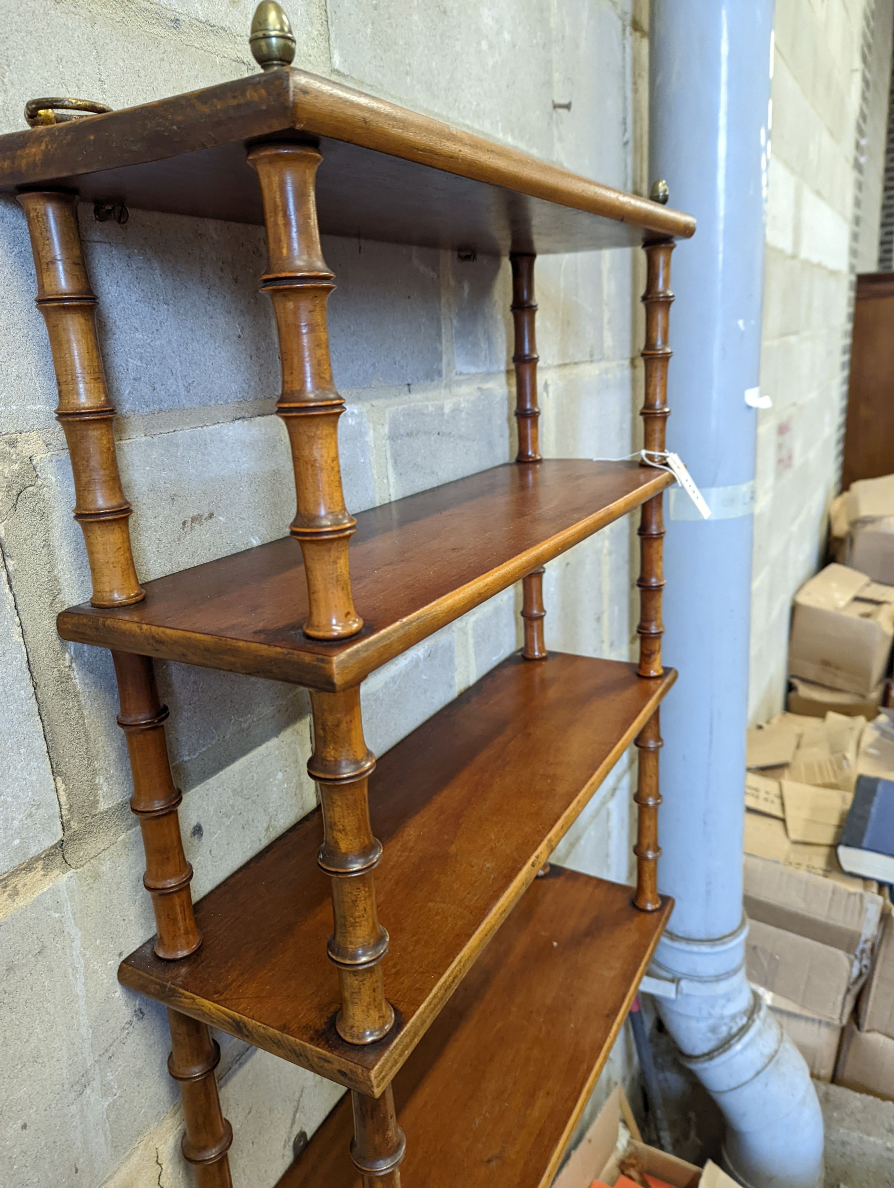 A Regency style mahogany four tier wall bracket, width 60cm, depth 19cm, height 80cm